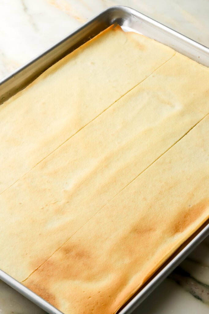 cake finished baking - golden and sliced in to three rectangles