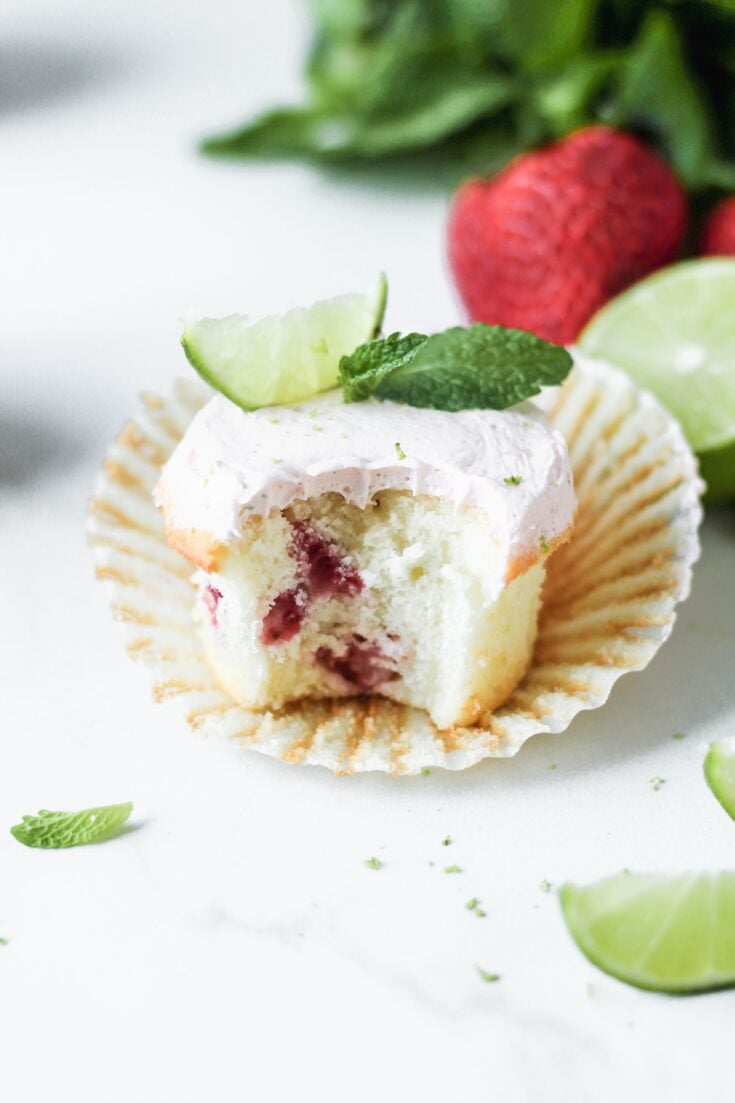 strawberry mojito cupcakes with limes on top and bite taken out