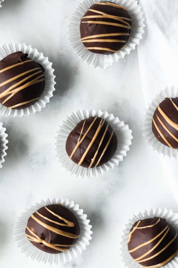 cookie dough truffles with chocolate coating and sunbutter drizzle