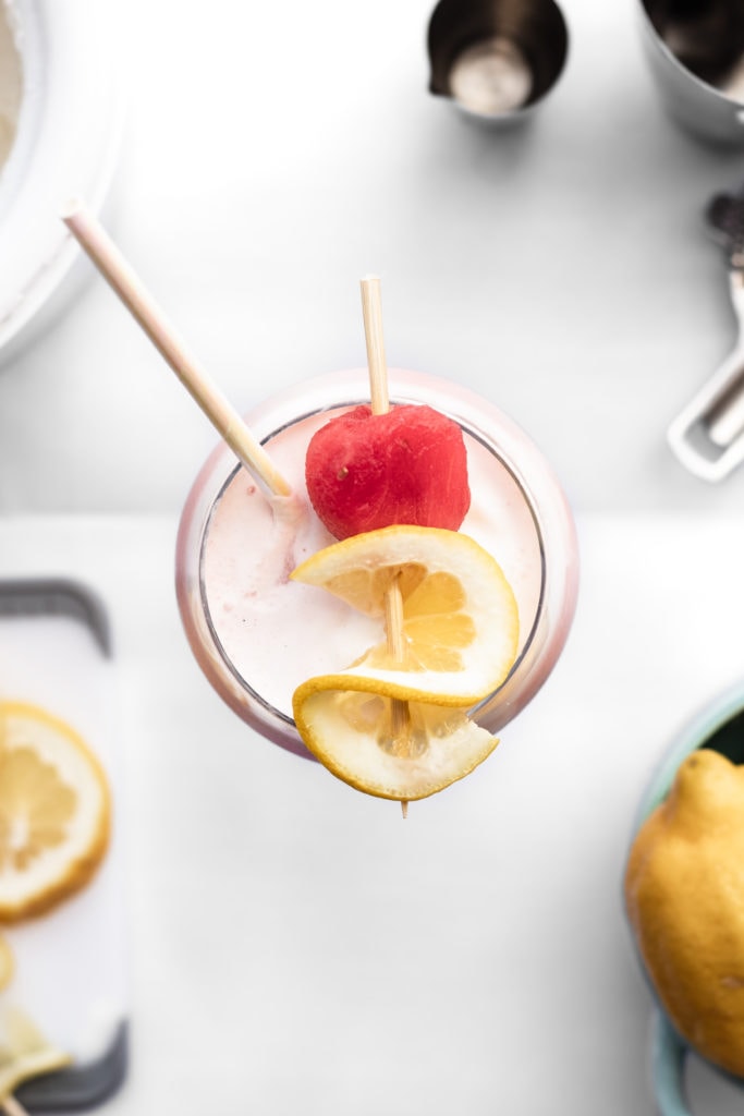 cocktail with lemon and watermelon garnish