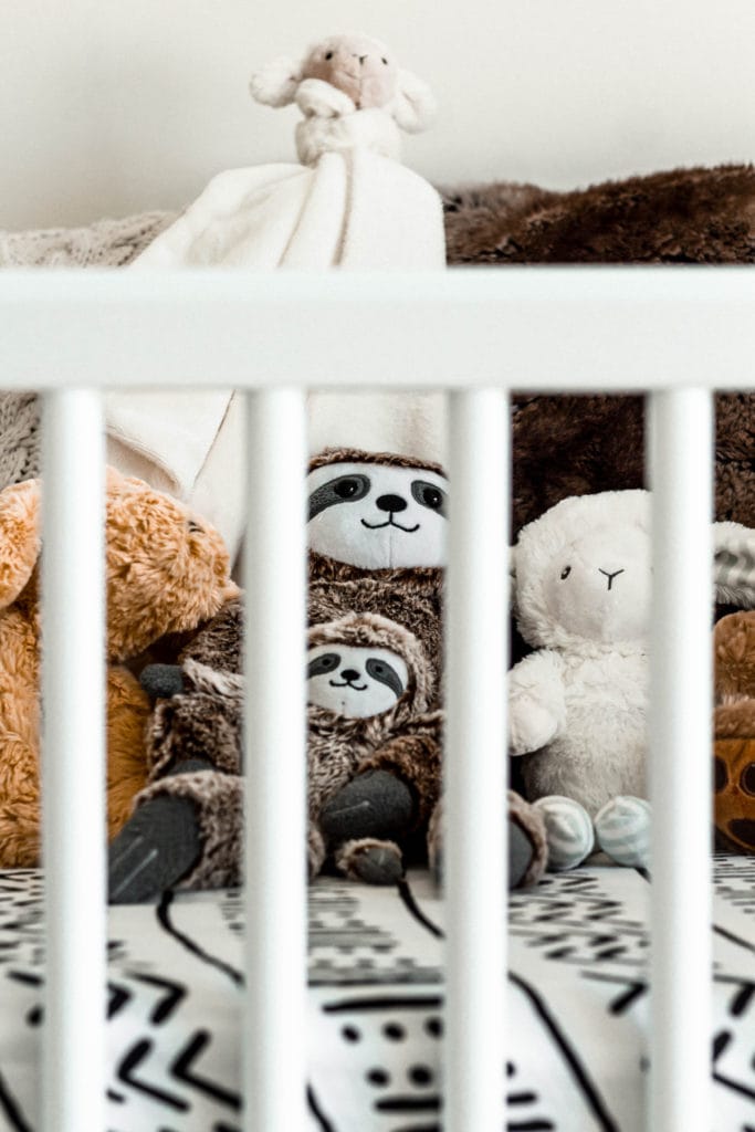 crib, stuffed animals