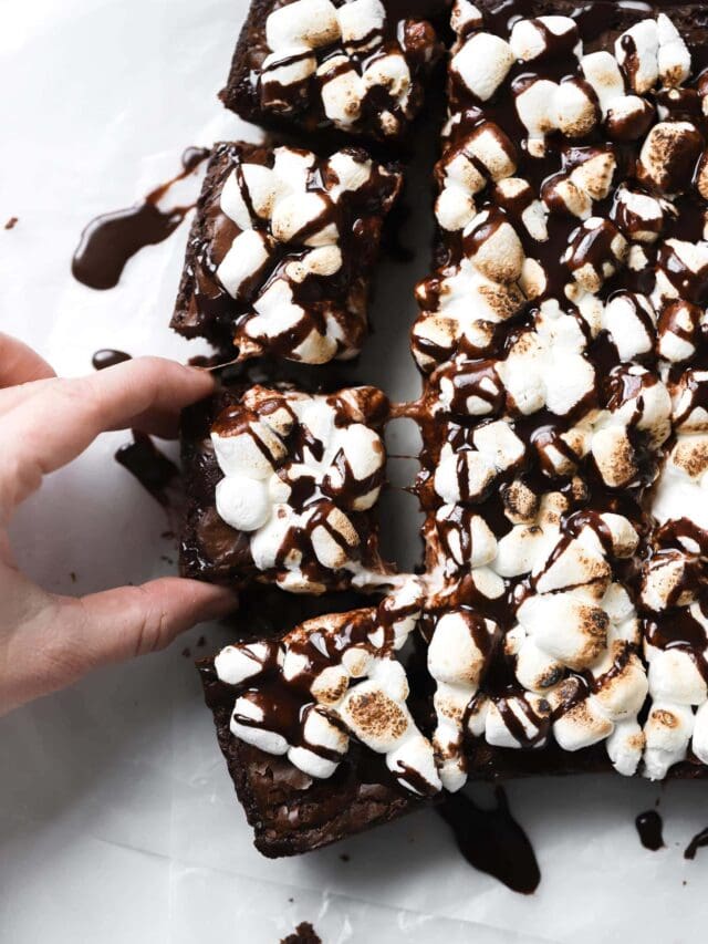 Rich brownies with toasted marshmallows and chocolate drizzle