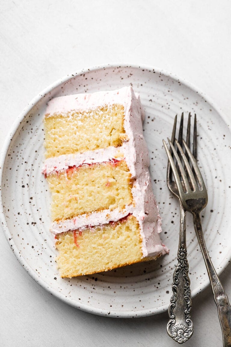 slice of a 6 inch cake with rhubarb frosting