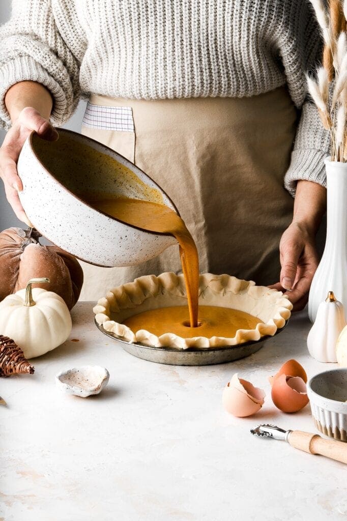 pour the pumpkin pie filling over the crust