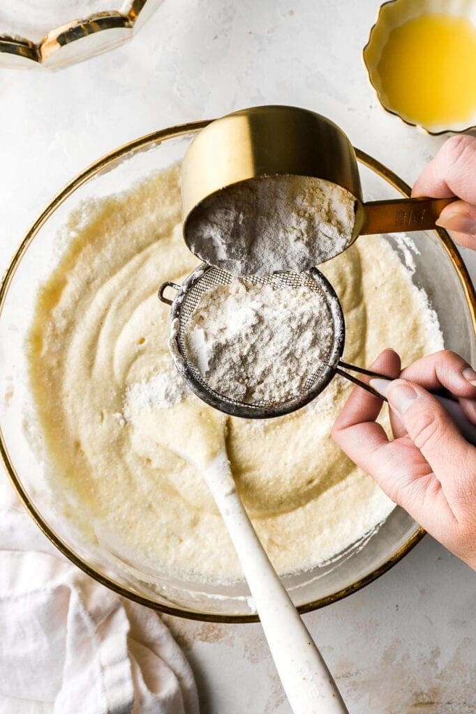 sift in the flour, half at a time
