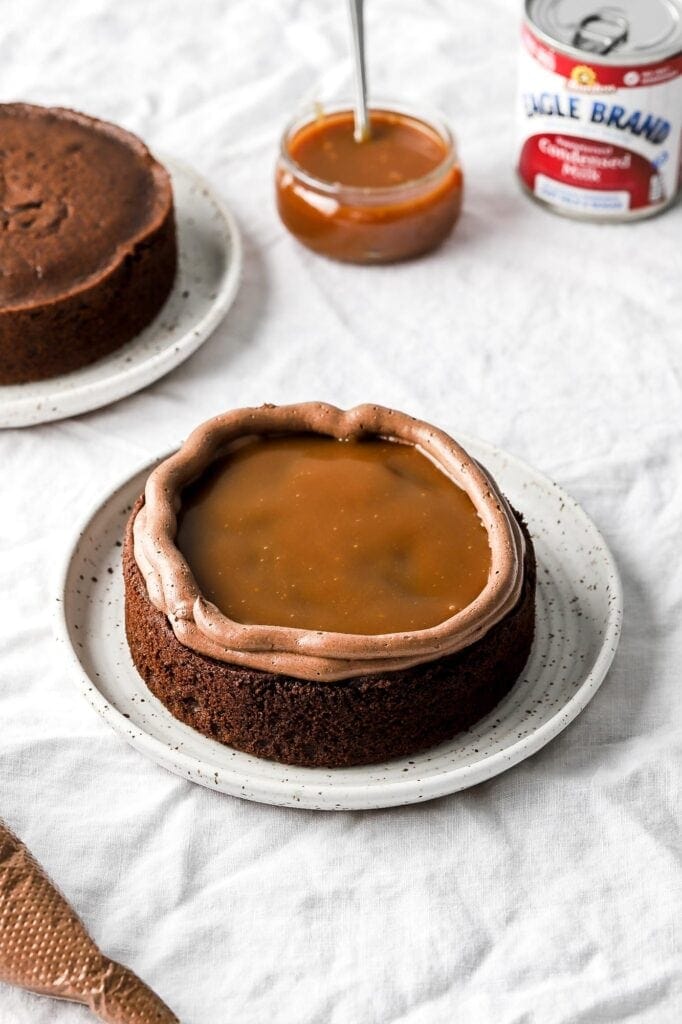 pipe a border of frosting and fill with caramel sauce
