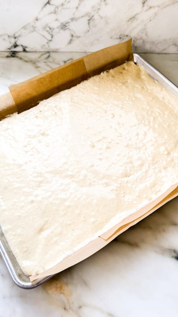 Unbaked cake layers in a baking tray for French Opera Cake.