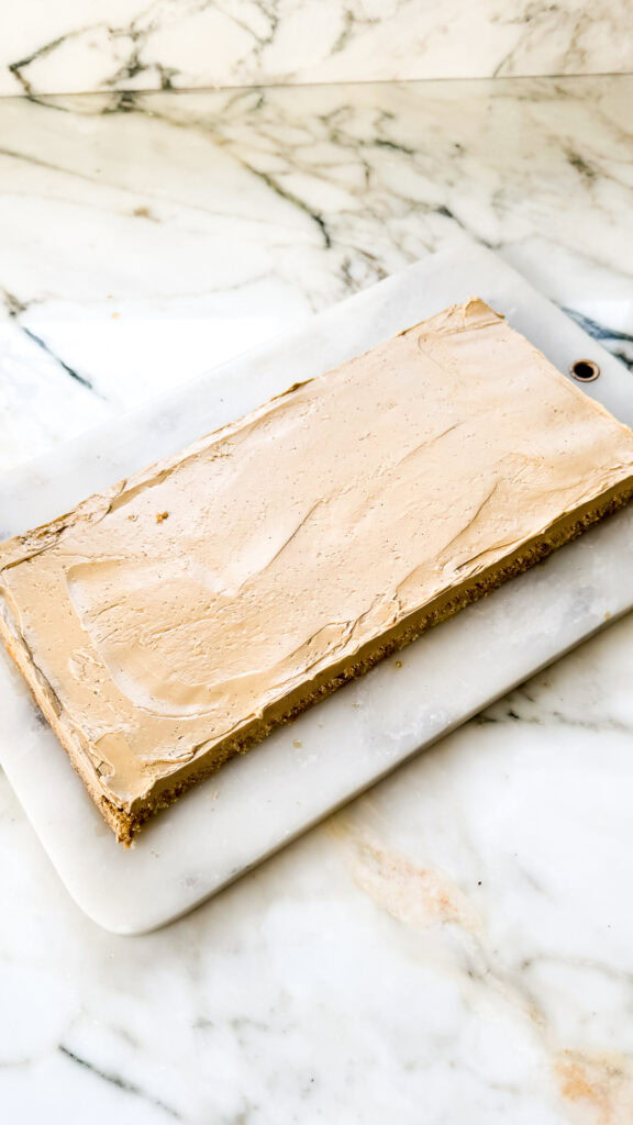 slice of jaconde sponge layered with coffee french buttercream