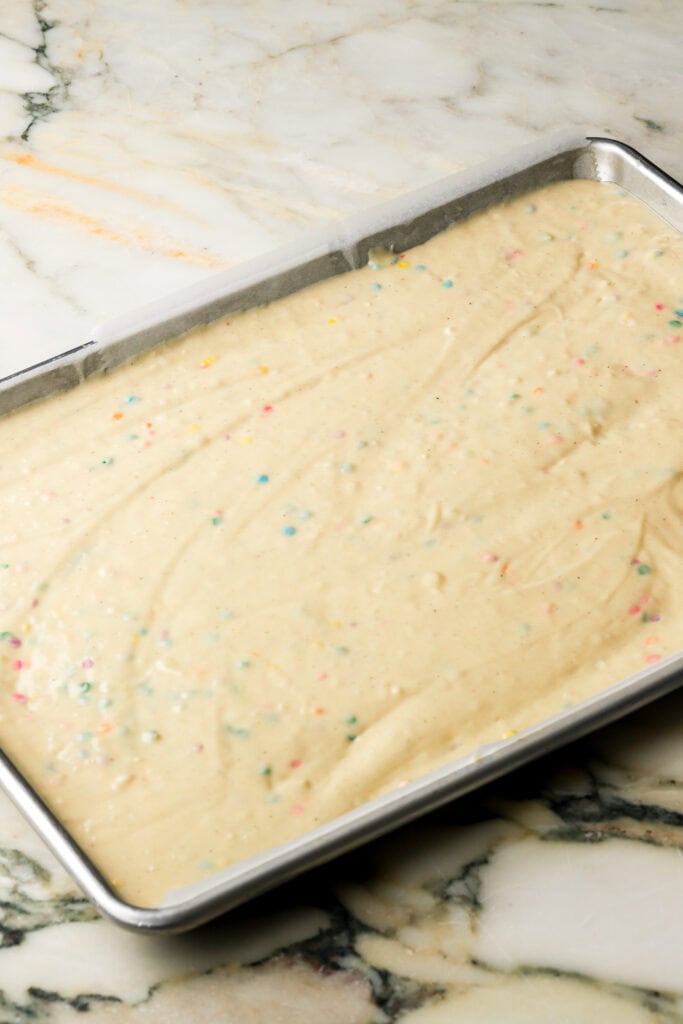 cake batter spread into prepared pan