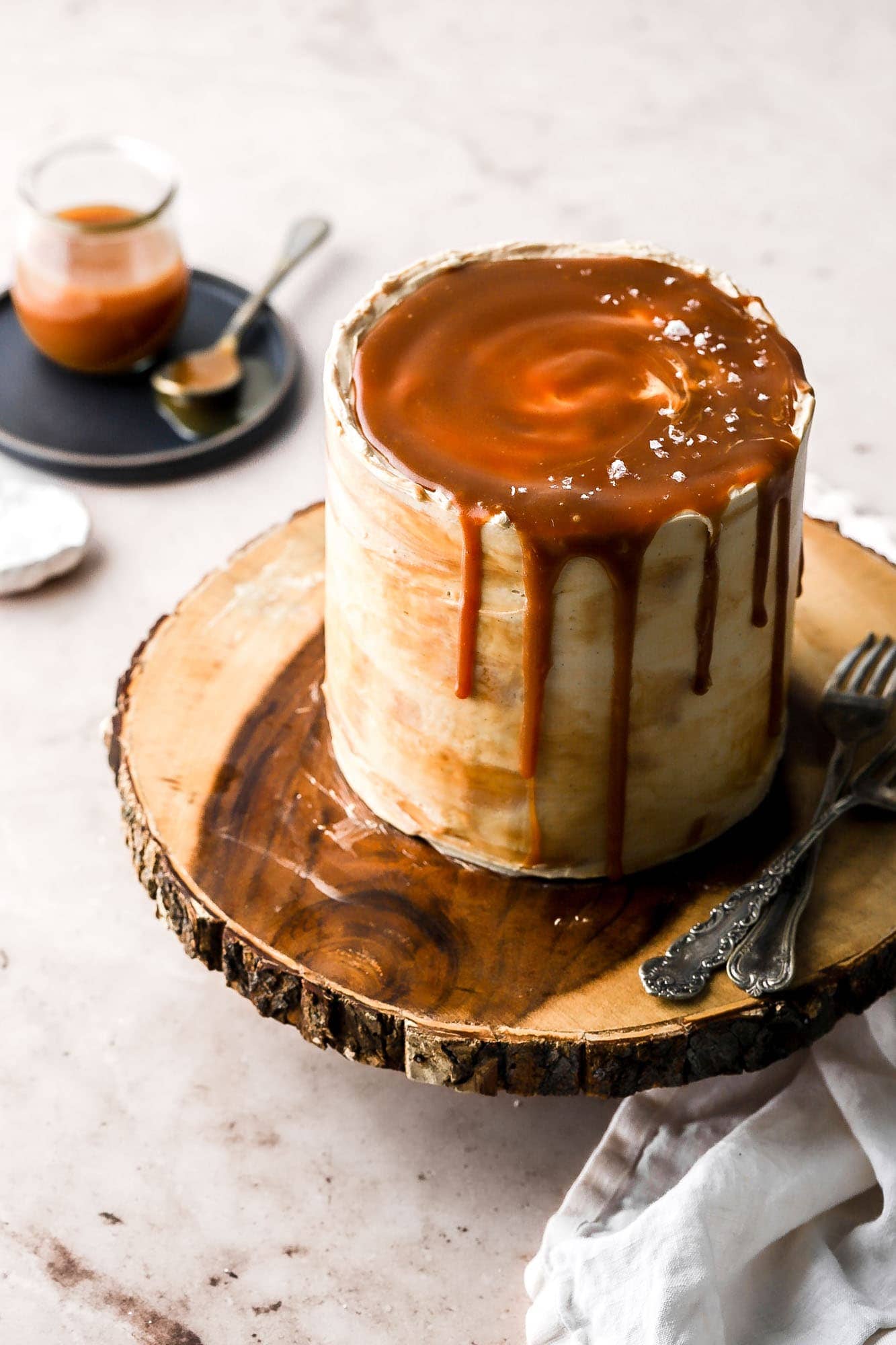 layer cake with vanilla buttercream and bourbon salted caramel sauce