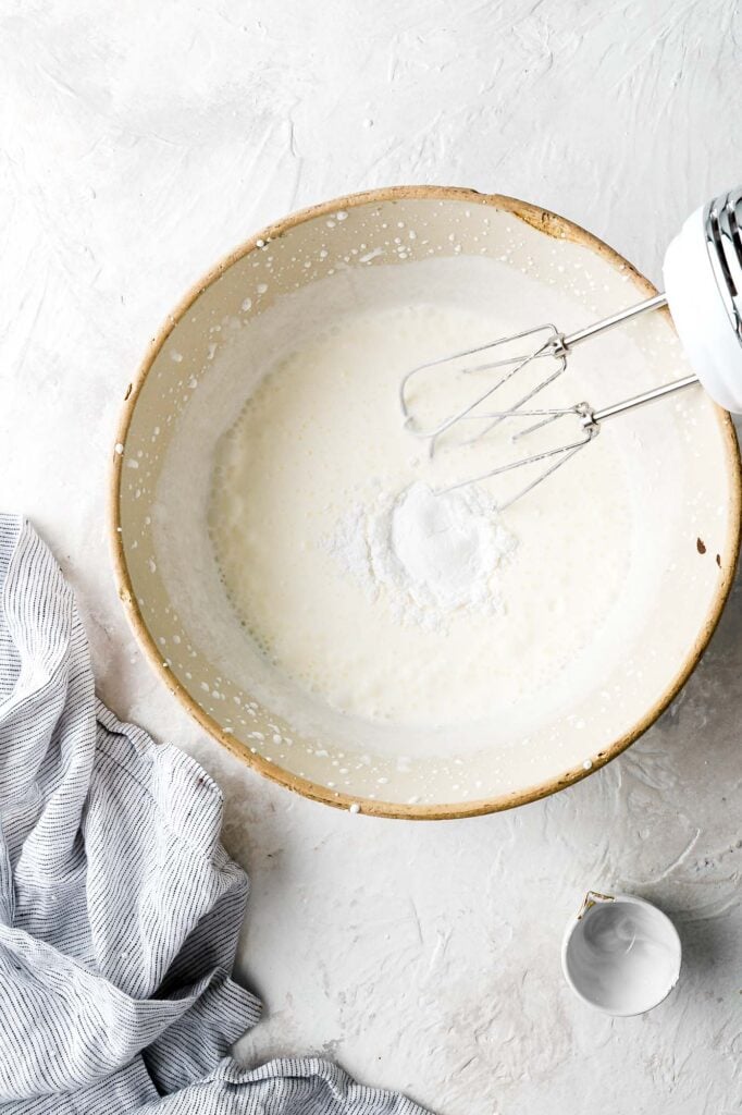 whipped cream thickened slightly, add powdered sugar