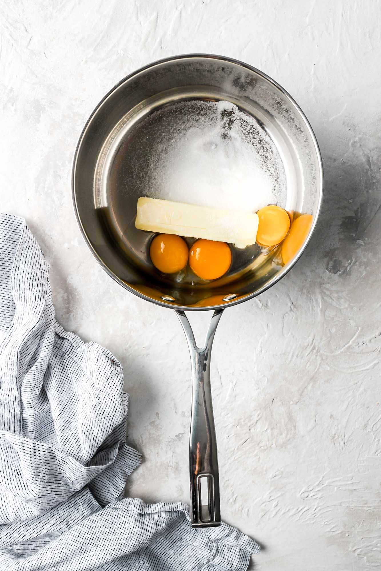 butter, sugar and eggs in saucepan