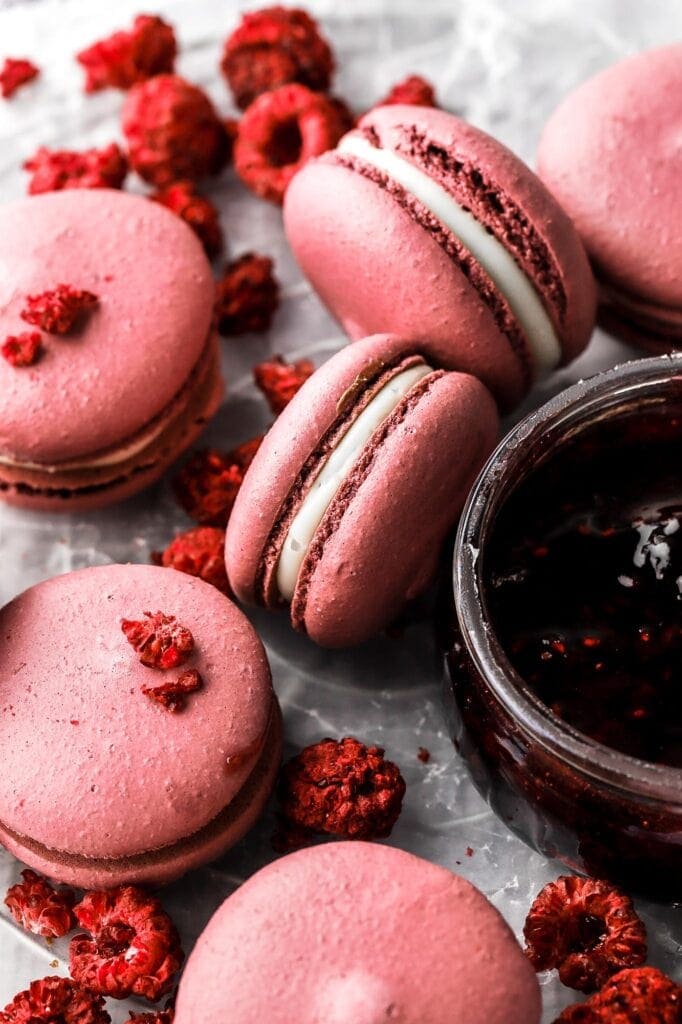 raspberry macarons with white chocolate ganache and raspberry jam