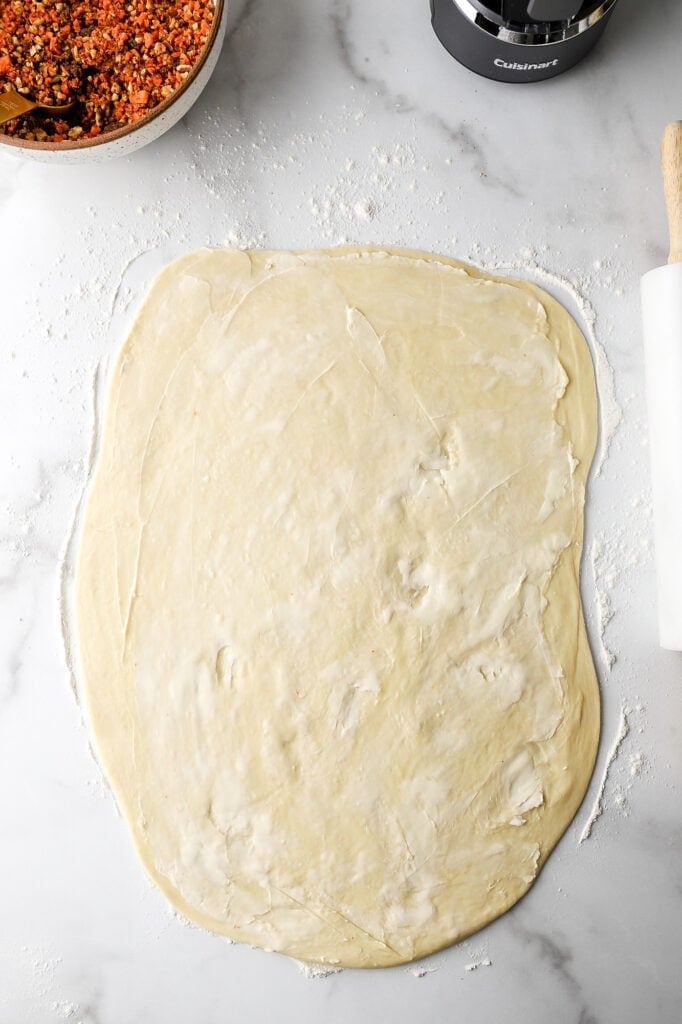 roll out dough and spread butter on top