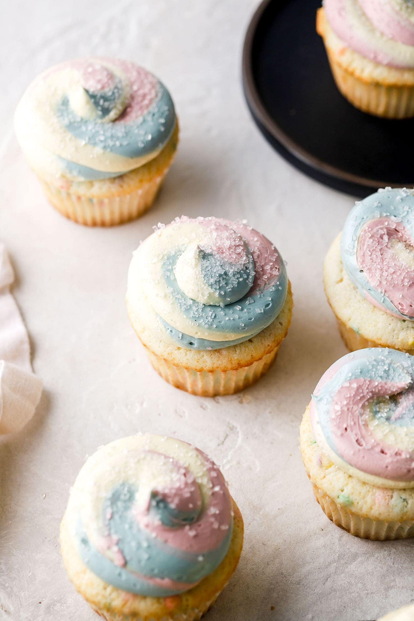 pink cupcakes with rainbow sprinkles