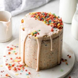 fruity pebble cake with cereal milk drizzle