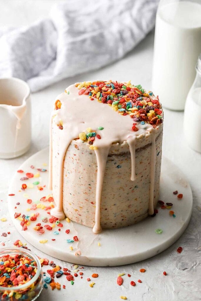 fruity pebble cake with cereal milk drizzle