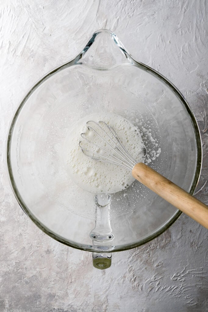 cooked egg whites and sugar looking frothy