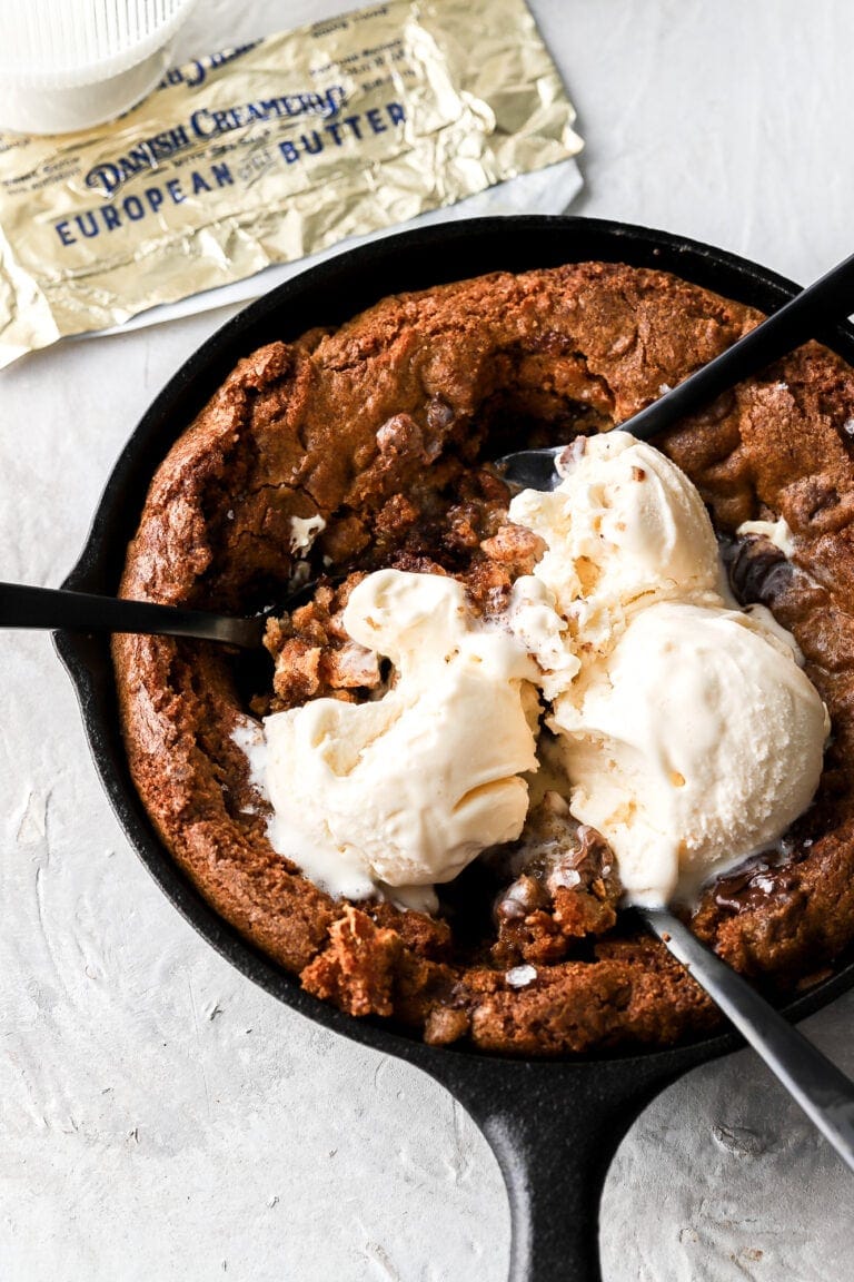 skillet cookie with ice cream and spoons