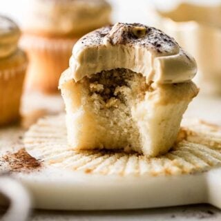 vanilla cupcakes with coffee soak and coffee buttercream with a bite taken