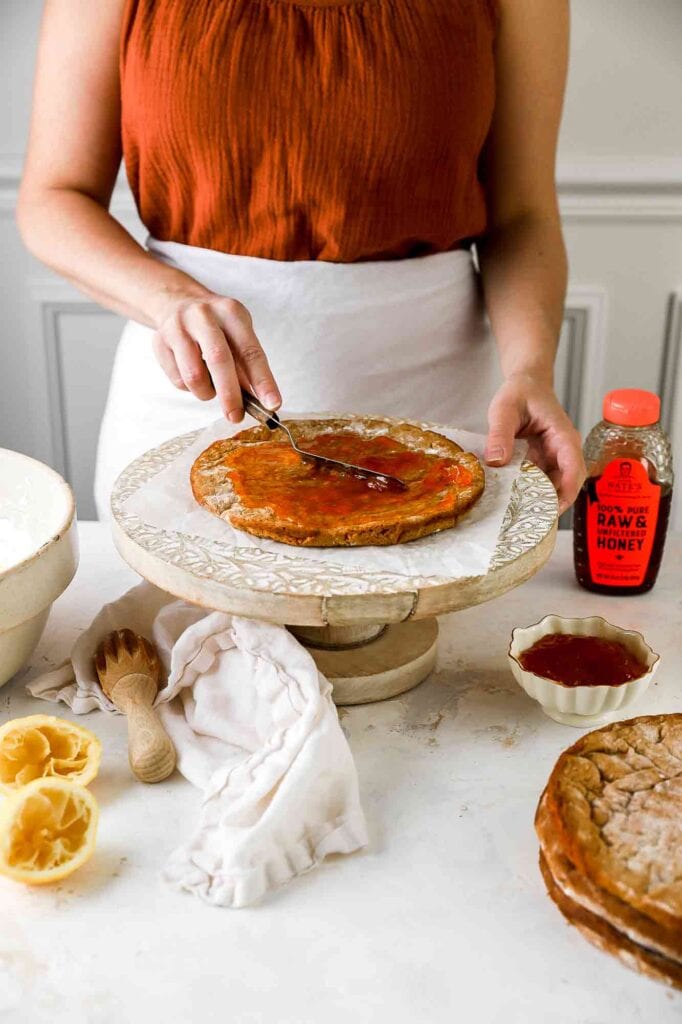 spread apricot filling on top of honey cake