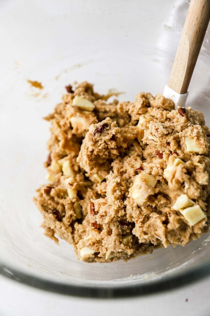 fold white chocolate chips and pecans into cookie dough