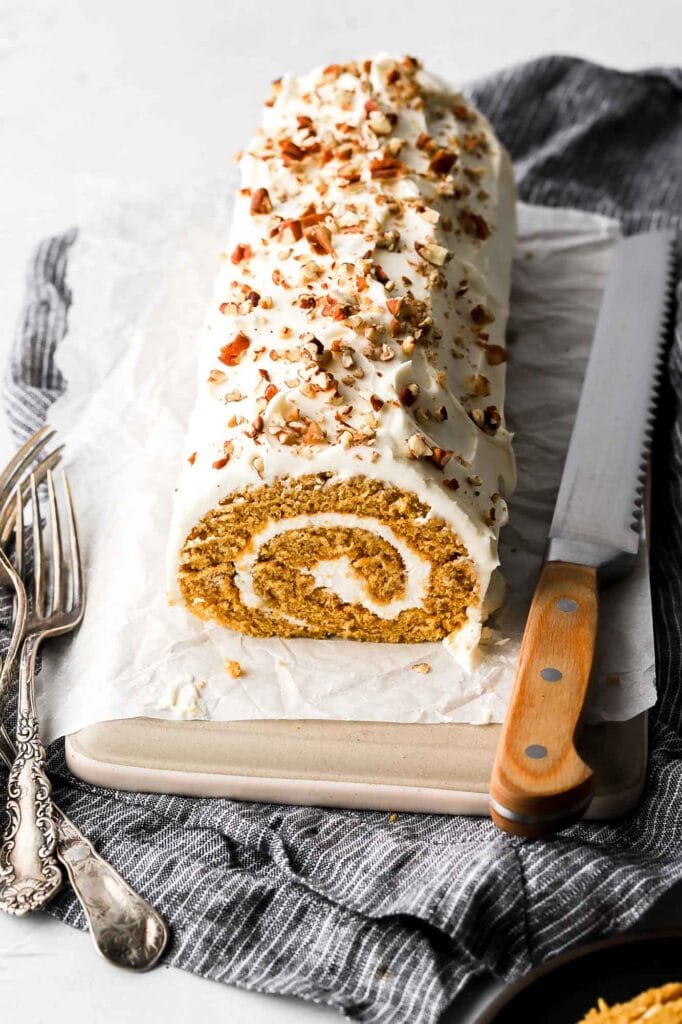 pumpkin roll with cream cheese frosting and pecans