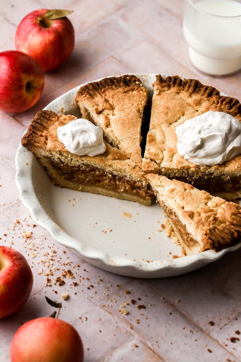 slices of rustic apple pie with whipped cream
