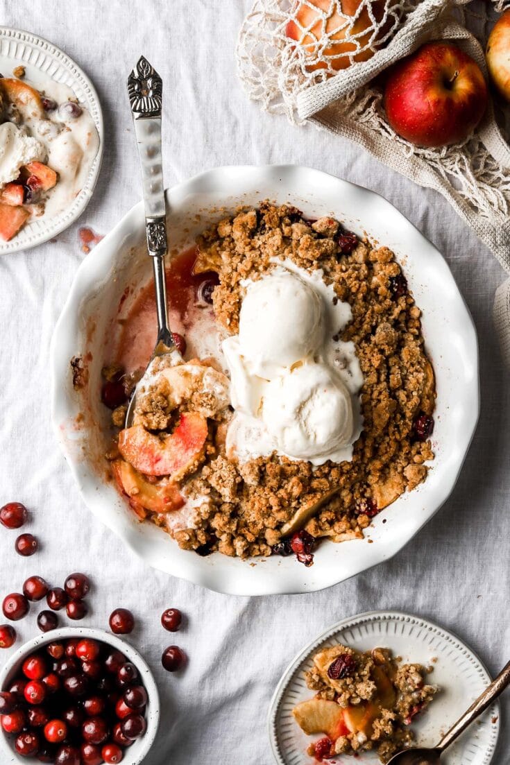 apple cranberry crisp with streusel topping and vanilla ice cream