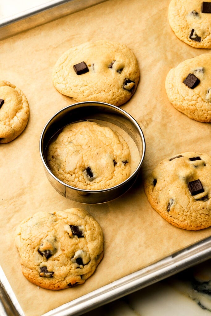 cookies 2/3 baked and scooted around with a round cookie cutter to make them neat