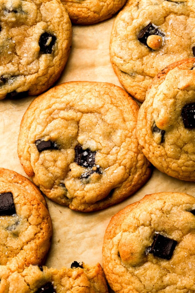 chocolate chip cookies on a baking sheet with flaky sea salt