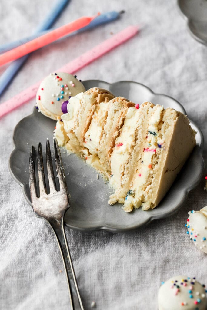 slice of macaron birthday cake