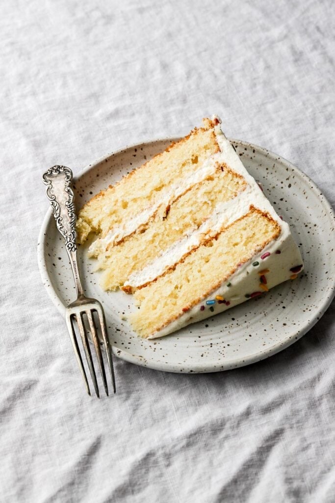 slice of vanilla cake with vanilla buttercream