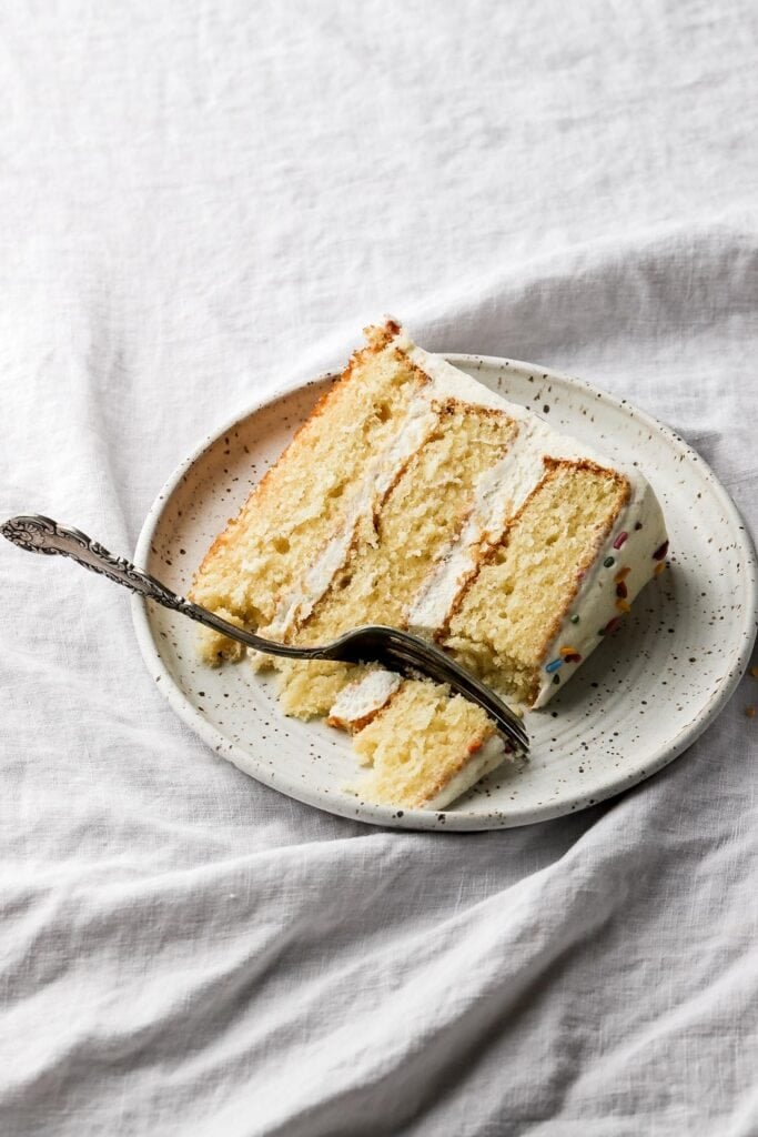 slice of vanilla cake with vanilla buttercream