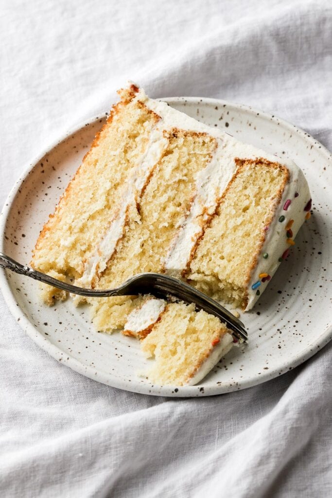 slice of vanilla cake with vanilla buttercream