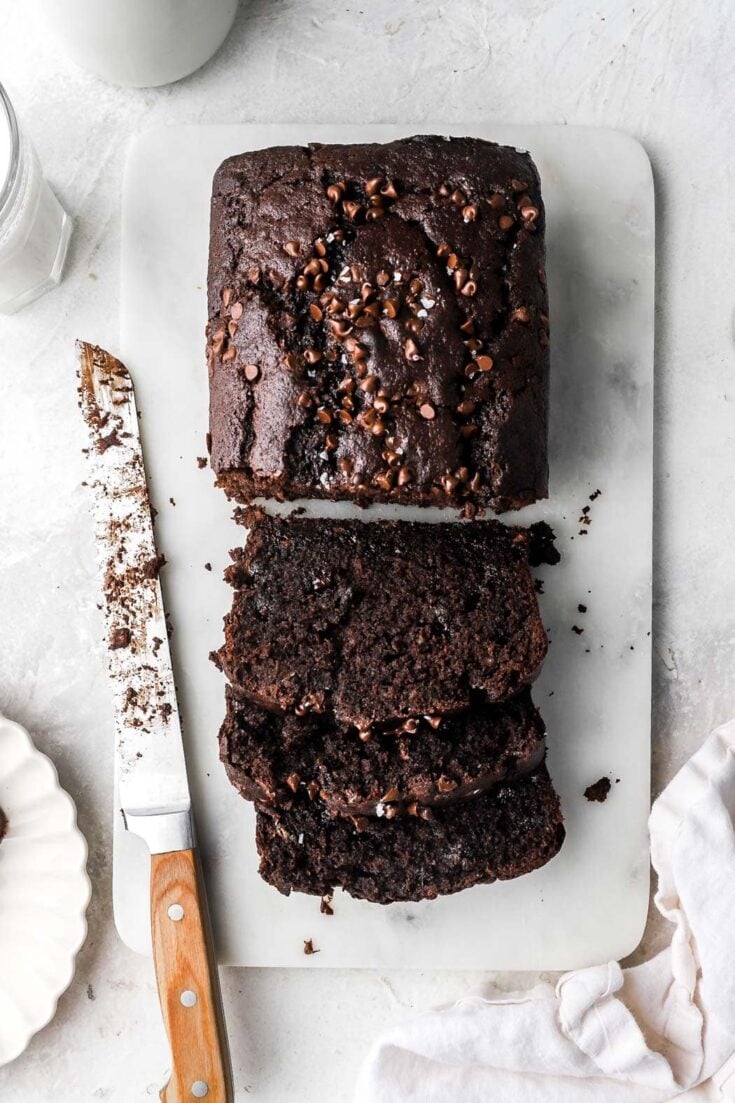 sliced chocolate banana bread with mini chocolate chips on top