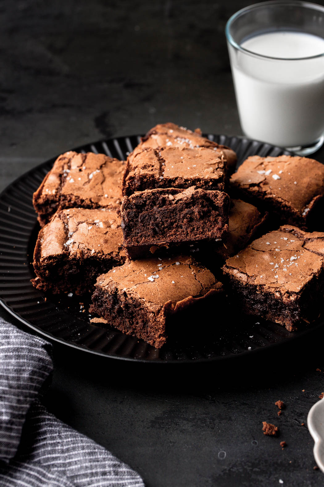 brownies topped with sea salt and glass of milk