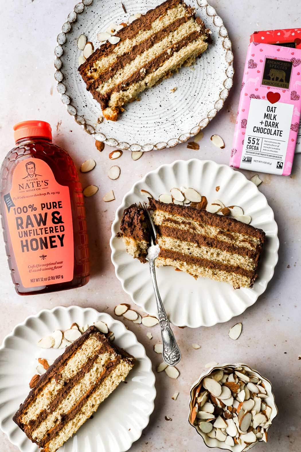 spiced honey chocolate cake slice with chocolate bars and honey