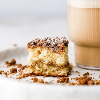 bite out of a coffee cake with coffee