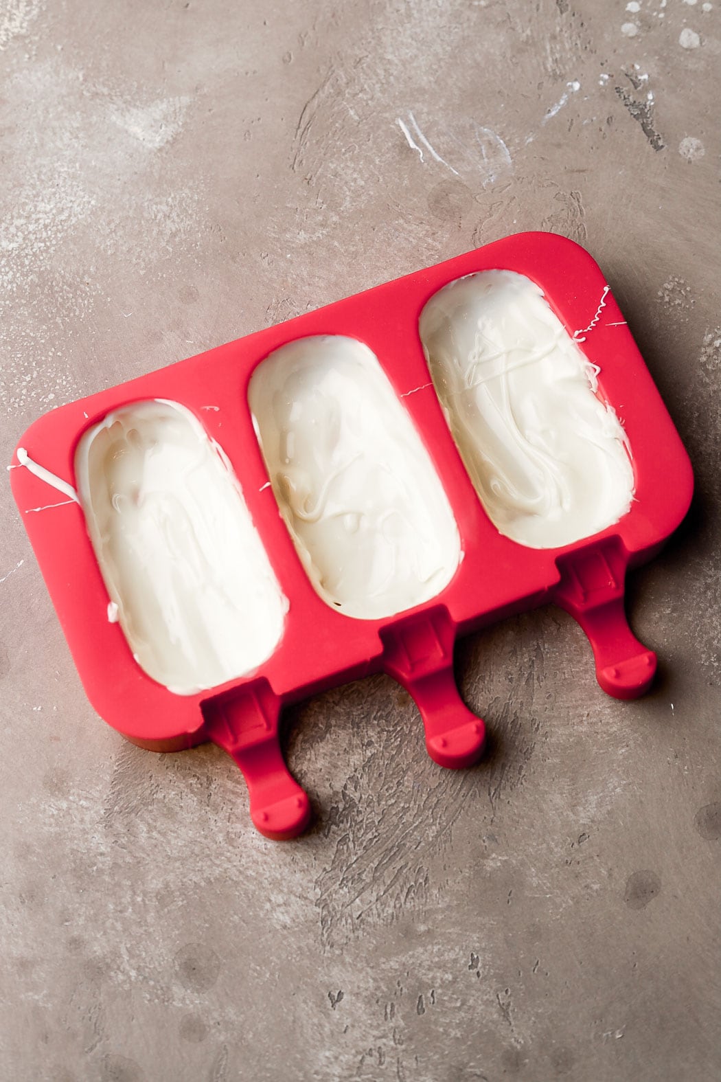 spread white chocolate into molds and let it set