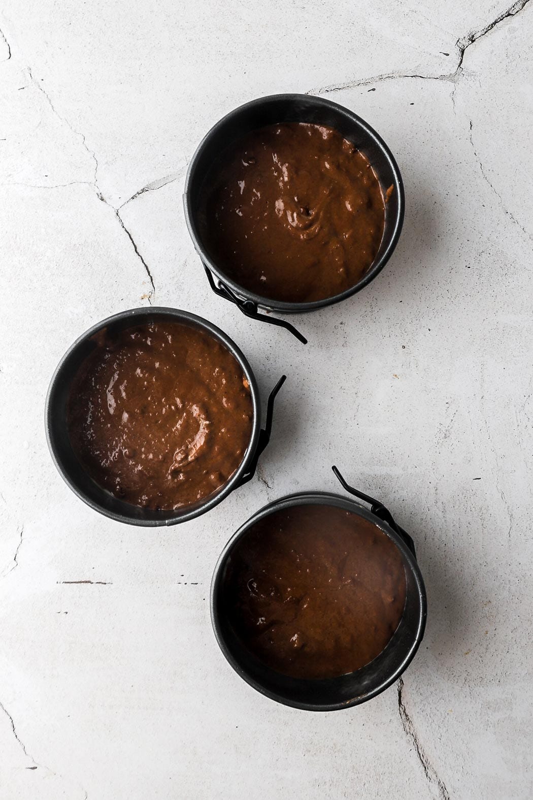 chocolate cake batter in 4 inch cake pans