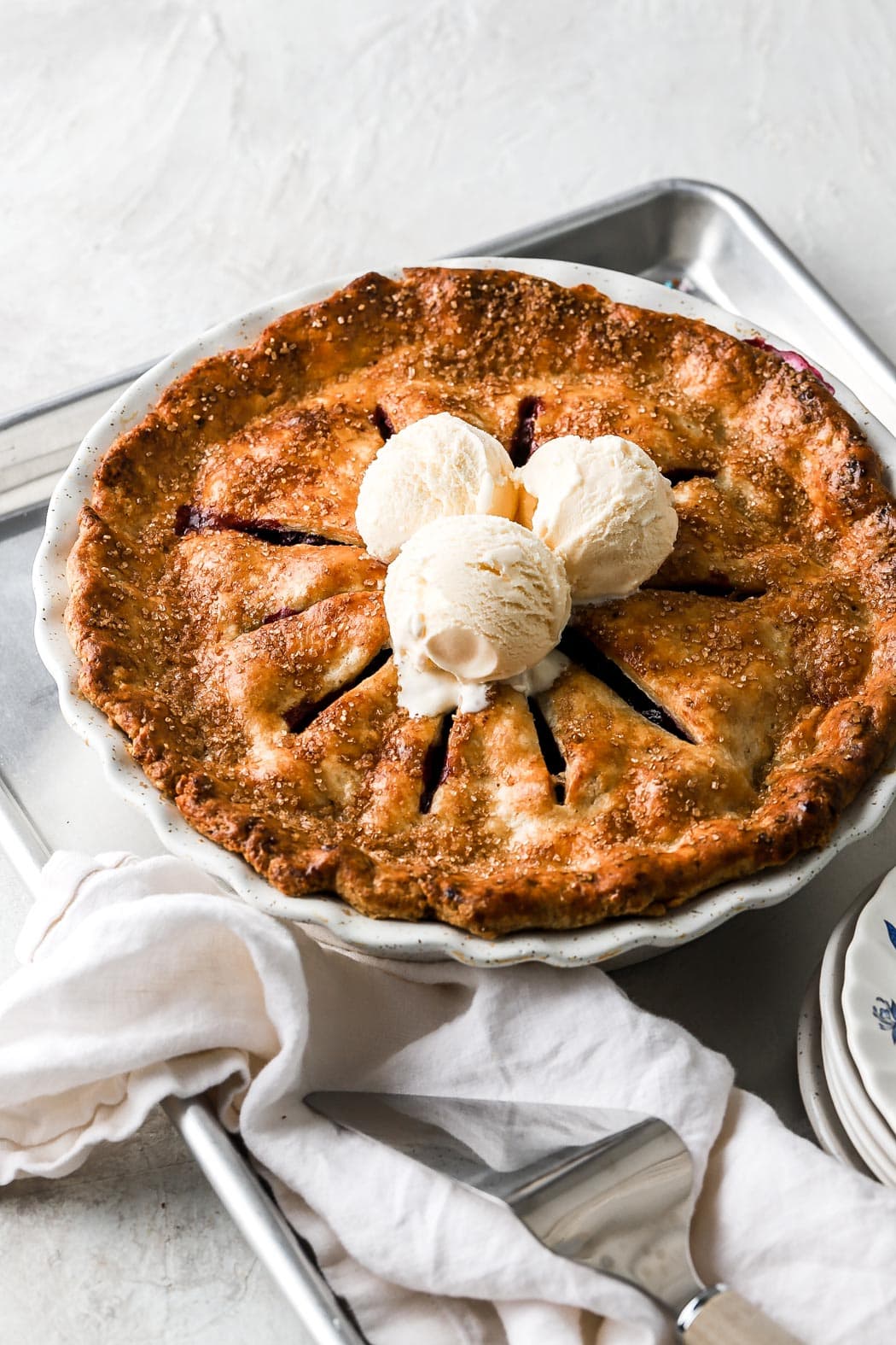 strawberry blueberry pie with vanilla ice cream on top