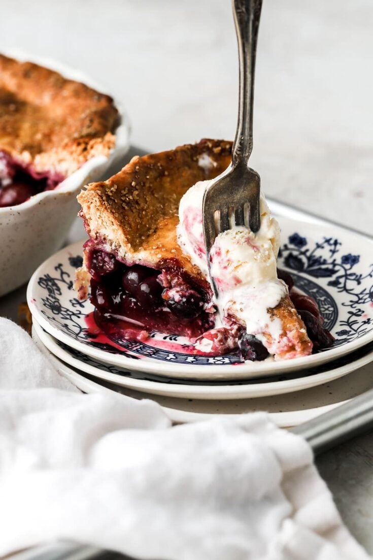 Strawberry blueberry pie with vanilla ice cream on top