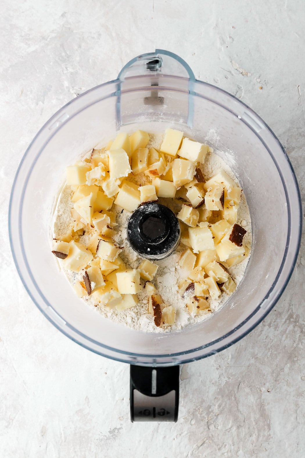 add cold cubed butter to food processor