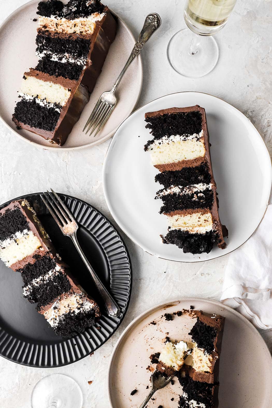 slices of tuxedo cake on plates with champagne