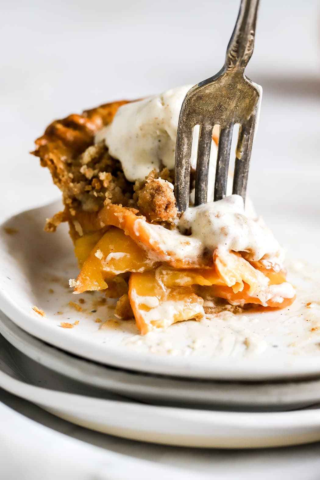 peach mango pie slice with ice cream