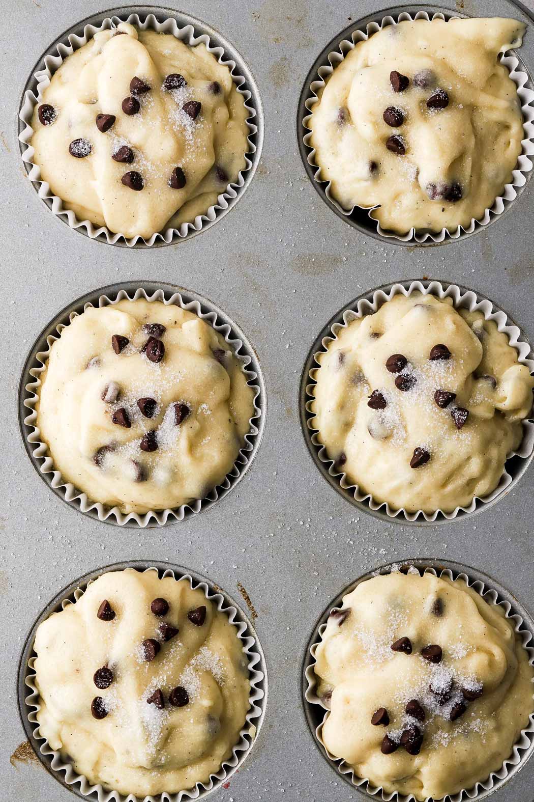 fill muffin tins to the top and top with sugar