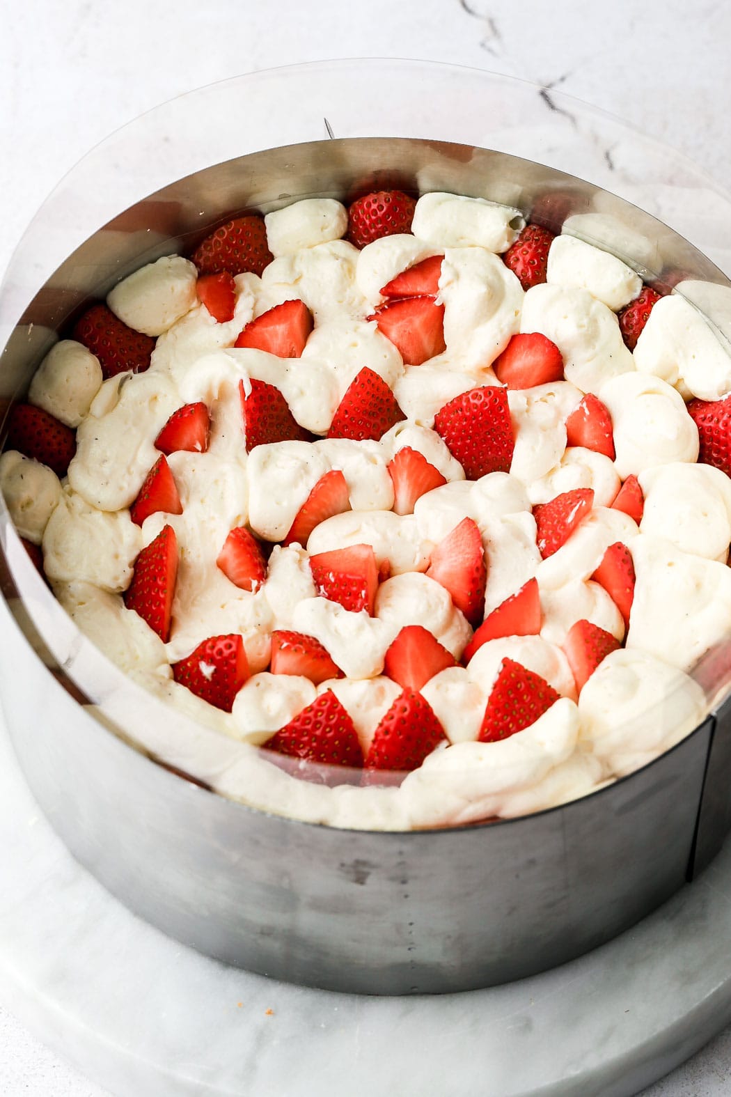 fill in the center with more strawberry slices and fill in empty spaces with cream