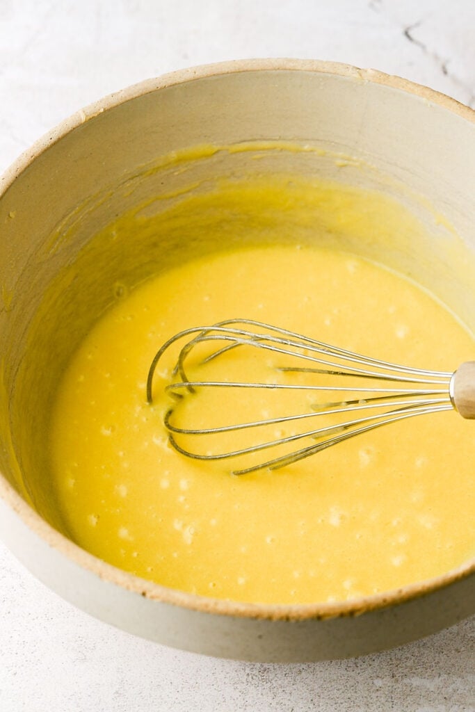 add the eggs, one at a time and whisk well between each one