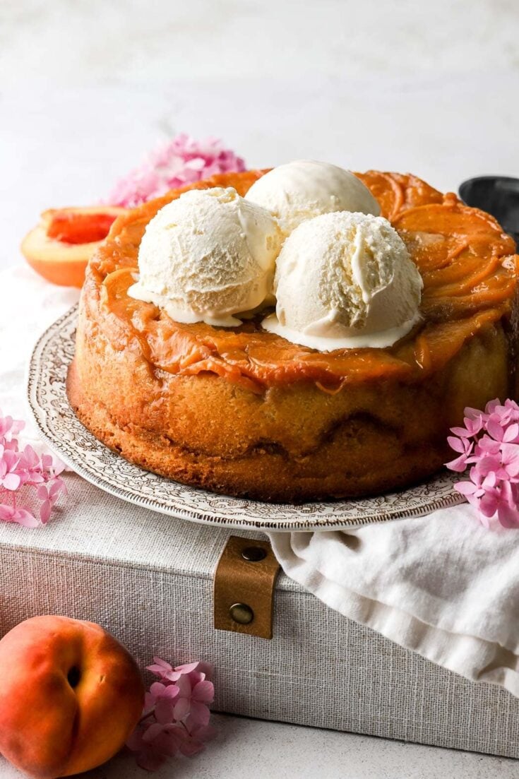 peach cobbler pound cake topped with ice cream
